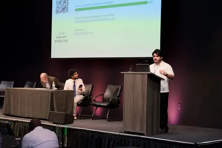 Ummah Unite co-founder Rayyan Naik on stage at the Niya Global Startup Summit, Computer History Museum, August 2026